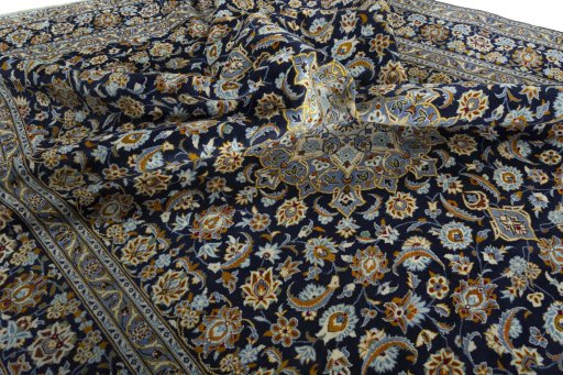 Surface texture of 2000s Kashan rug with natural Wool and intricate pattern