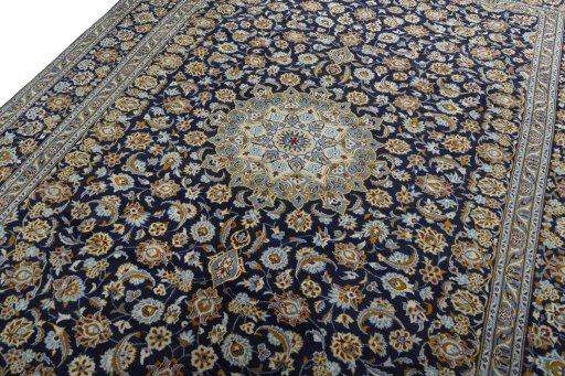 Backside of handmade 2000s Kashan rug showing knot structure and weave density