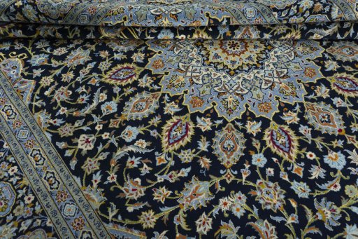 Close-up detail of 2000s Kashan rug from Iran / Persia showing Wool weave