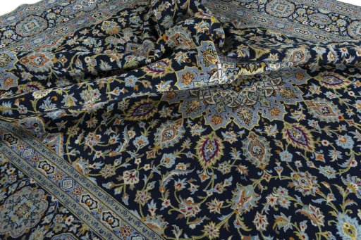 Surface texture of 2000s Kashan rug with natural Wool and intricate pattern