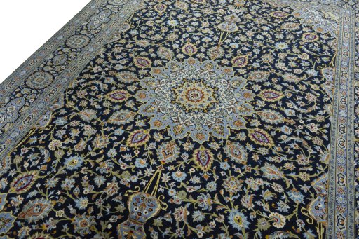 Backside of handmade 2000s Kashan rug showing knot structure and weave density
