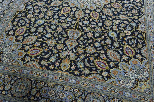 Close-up detail of 2000s Kashan rug from Iran / Persia showing Wool weave