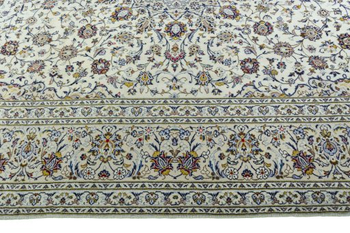 Corner detail of 2000s Kashan rug showing border pattern and Wool pile
