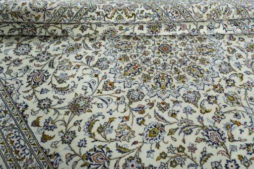 Close-up detail of 2000s Kashan rug from Iran / Persia showing Wool weave