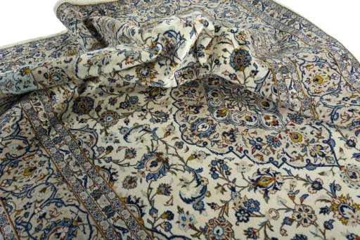 Surface texture of 2000s Kashan rug with natural Wool and intricate pattern