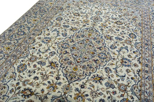 Backside of handmade 2000s Kashan rug showing knot structure and weave density