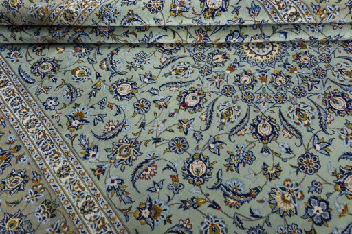 Close-up detail of 2000s Kashan rug from Iran / Persia showing Wool weave