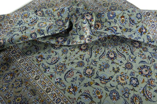 Surface texture of 2000s Kashan rug with natural Wool and intricate pattern