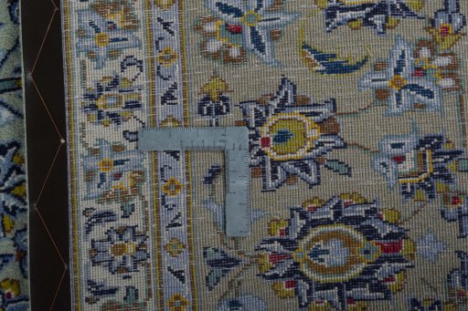 Backside of handmade 2000s Kashan rug showing knot structure and weave density
