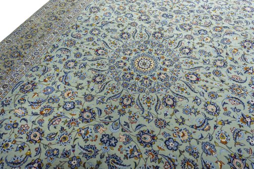 Backside of handmade 2000s Kashan rug showing knot structure and weave density