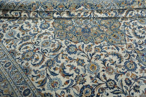 Close-up detail of 2000s Kashan rug from Iran / Persia showing Wool weave