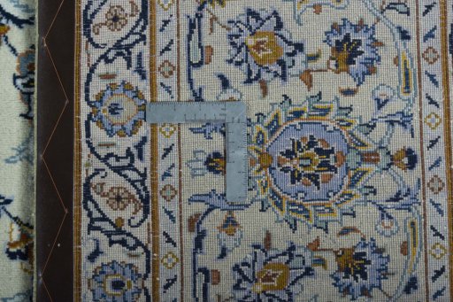 Backside of handmade 2000s Kashan rug showing knot structure and weave density