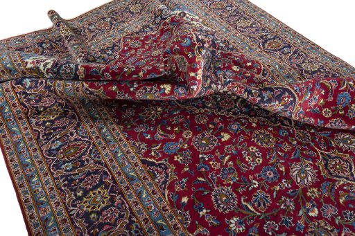 Surface texture of 2000s Kashan rug with natural Wool and intricate pattern