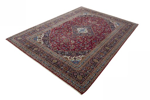 Corner detail of 2000s Kashan rug showing border pattern and Wool pile