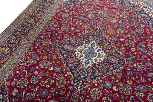 Backside of handmade 2000s Kashan rug showing knot structure and weave density
