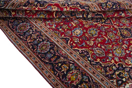 Close-up detail of 2000s Kashan rug from Iran / Persia showing Wool weave