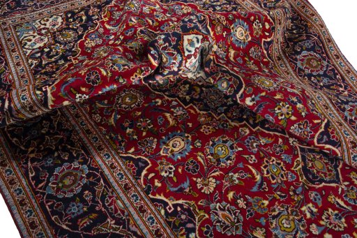 Surface texture of 2000s Kashan rug with natural Wool and intricate pattern