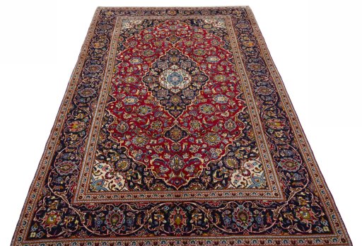 Surface texture of 2000s Kashan rug with natural Wool and intricate pattern