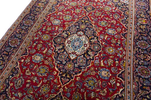 Backside of handmade 2000s Kashan rug showing knot structure and weave density