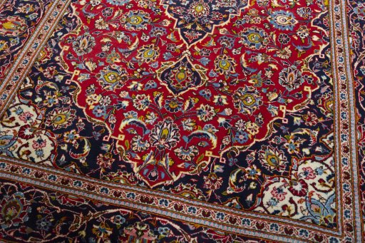 Close-up detail of 2000s Kashan rug from Iran / Persia showing Wool weave