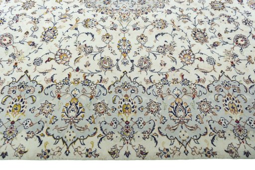 Corner detail of 2000s Kashan rug showing border pattern and Wool pile