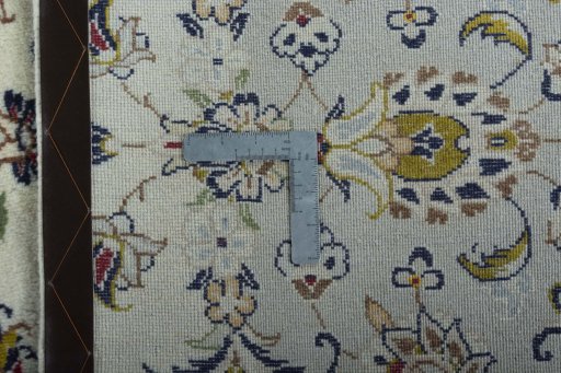 Backside of handmade 2000s Kashan rug showing knot structure and weave density
