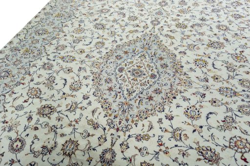 Backside of handmade 2000s Kashan rug showing knot structure and weave density