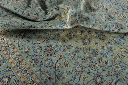 Surface texture of 2000s Kashan rug with natural Wool and intricate pattern