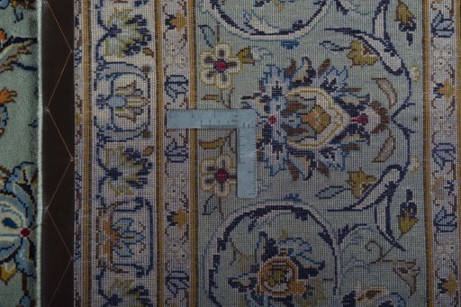 Backside of handmade 2000s Kashan rug showing knot structure and weave density