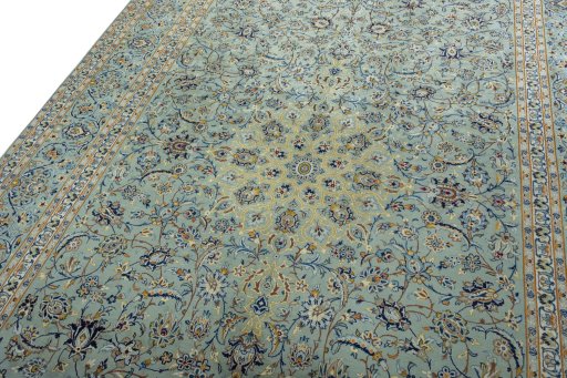 Backside of handmade 2000s Kashan rug showing knot structure and weave density