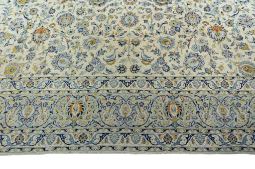 Corner detail of 2000s Kashan rug showing border pattern and Wool pile