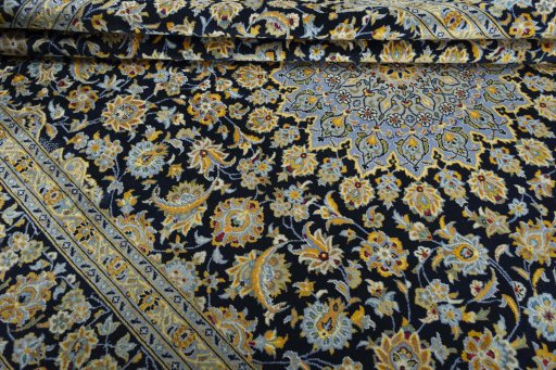 Close-up detail of 2000s Kashan rug from Iran / Persia showing Wool weave