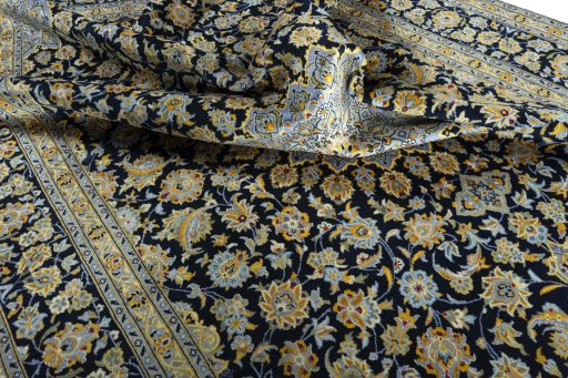 Surface texture of 2000s Kashan rug with natural Wool and intricate pattern