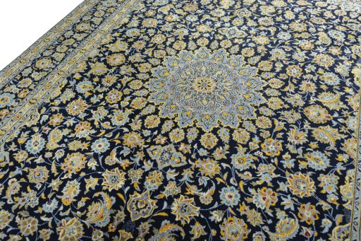 Backside of handmade 2000s Kashan rug showing knot structure and weave density