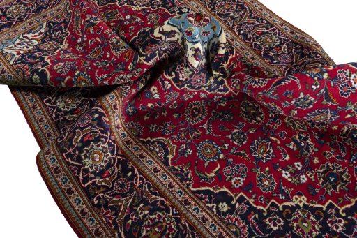 Surface texture of 2000s Kashan rug with natural Wool and intricate pattern