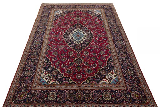 Surface texture of 2000s Kashan rug with natural Wool and intricate pattern