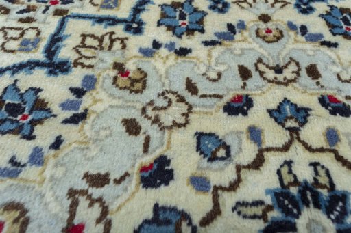 Backside of handmade 2000s Kashan rug showing knot structure and weave density