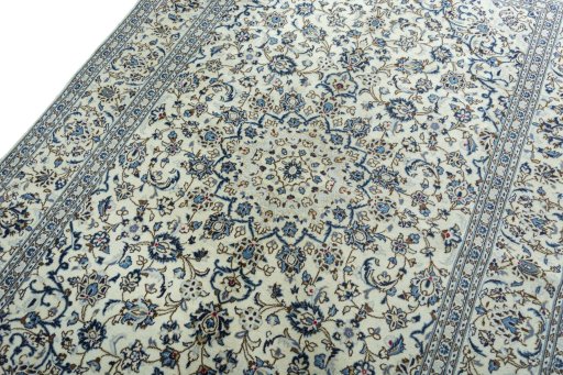 Backside of handmade 2000s Kashan rug showing knot structure and weave density