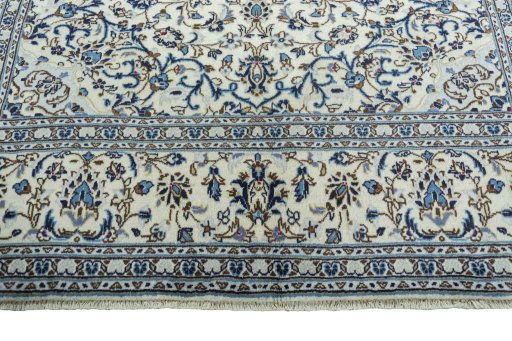 Full view of 2000s Kashan rug from Iran / Persia, 302 × 196 cm in Beige tones