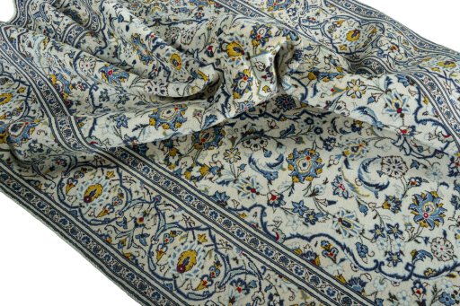 Surface texture of 2000s Kashan rug with natural Wool and intricate pattern