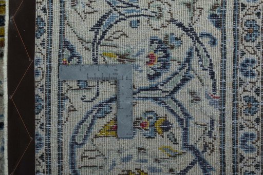 Backside of handmade 2000s Kashan rug showing knot structure and weave density