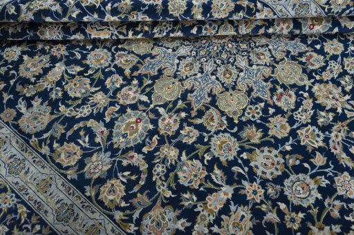 Close-up detail of 2000s Kashan rug from Iran / Persia showing Wool weave