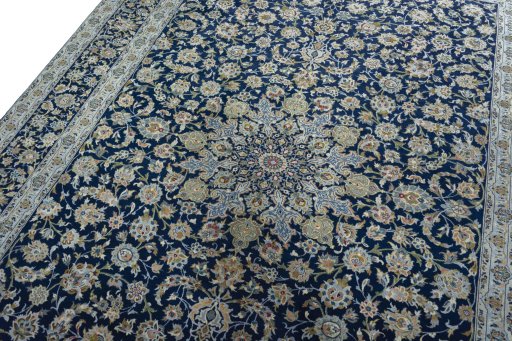 Backside of handmade 2000s Kashan rug showing knot structure and weave density