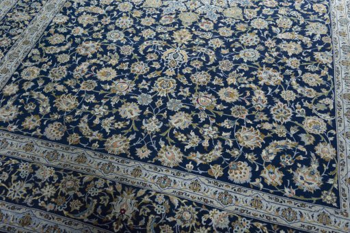 Close-up detail of 2000s Kashan rug from Iran / Persia showing Wool weave