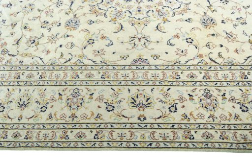 Corner detail of New Kashan rug showing border pattern and Wool pile