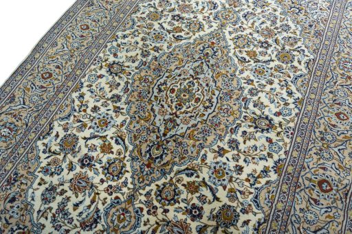 Backside of handmade 2000s Kashan rug showing knot structure and weave density