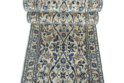 Corner detail of 2000s Kashan rug showing border pattern and Wool pile