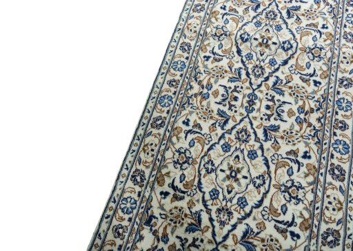 Backside of handmade 2000s Kashan rug showing knot structure and weave density