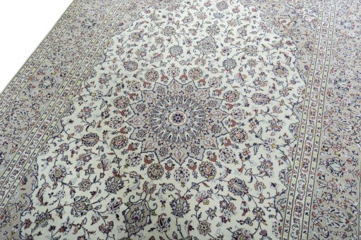 Backside of handmade 2000s Kashan rug showing knot structure and weave density