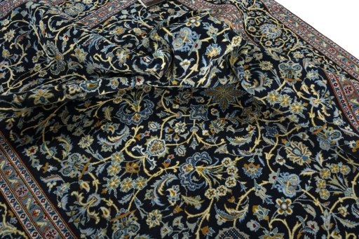 Surface texture of 2000s Kashan rug with natural Wool and intricate pattern